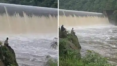 Un hombre desafía la crecida del Río Marapa en Tucumán durante la apertura del Dique Escaba